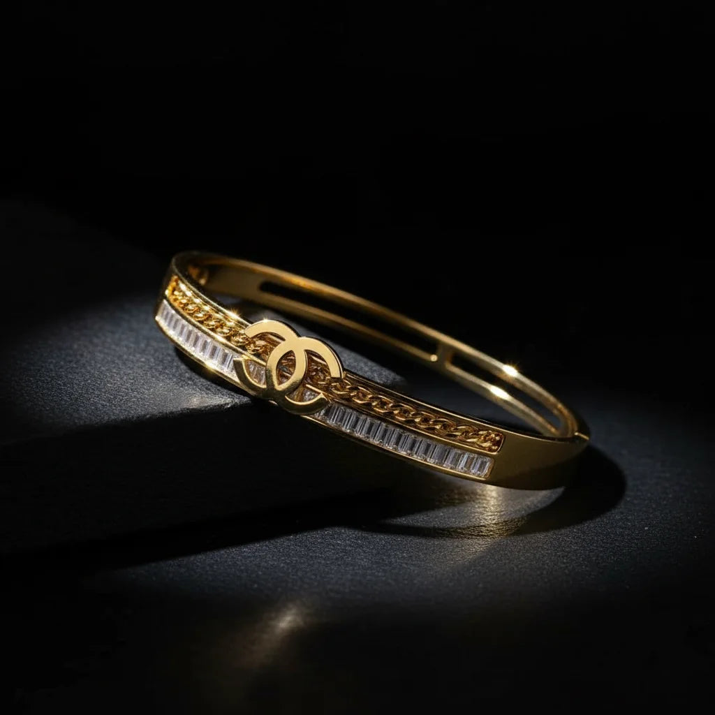 Gold bracelet with intricate design on a dark background