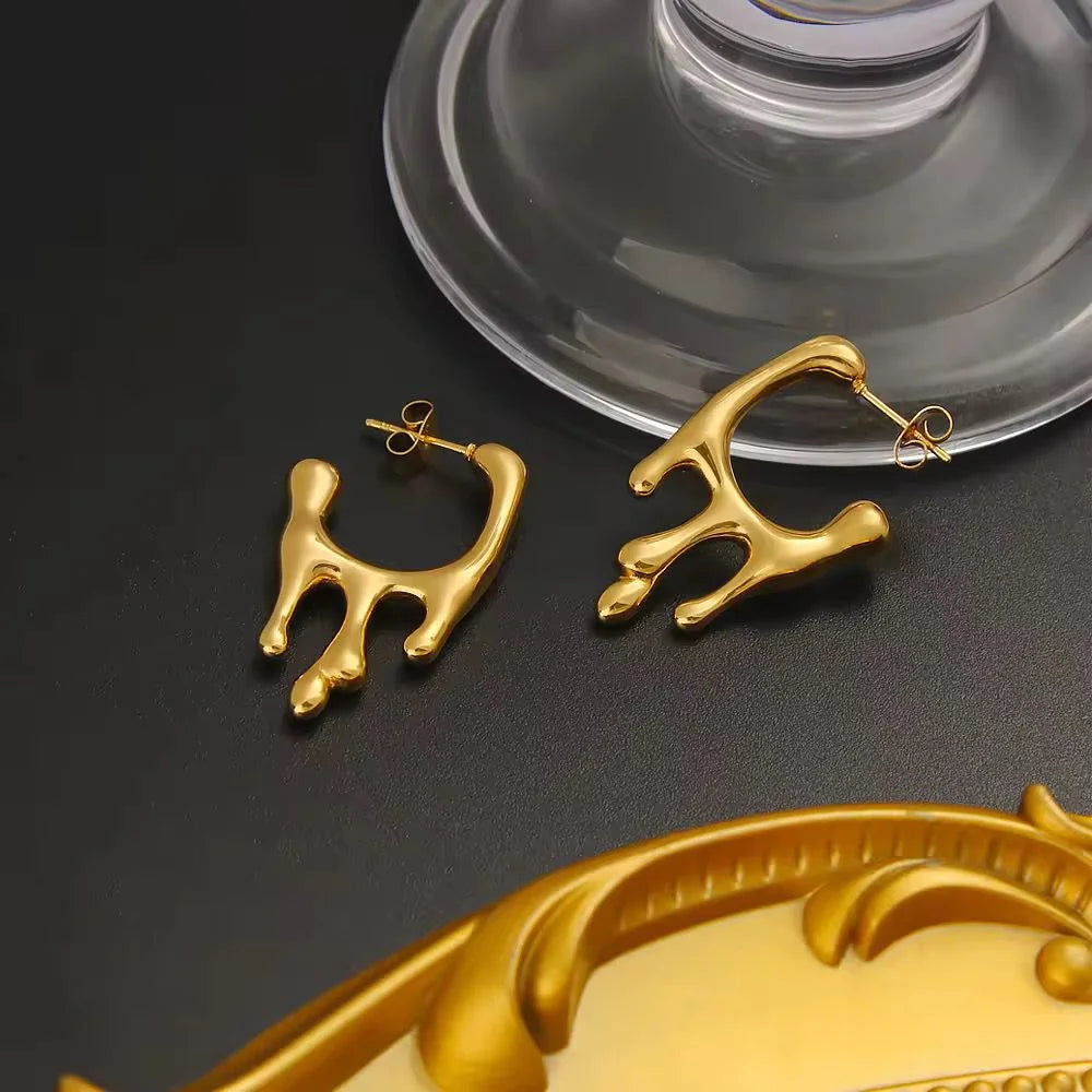 rain drop earings near glass