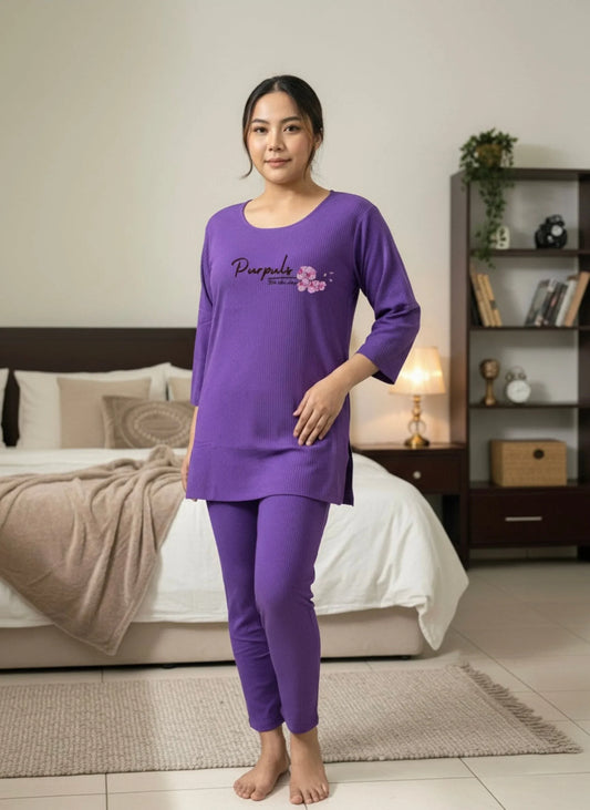 Asian woman in a purple night dress set standing in cozy bedroom with modern decor