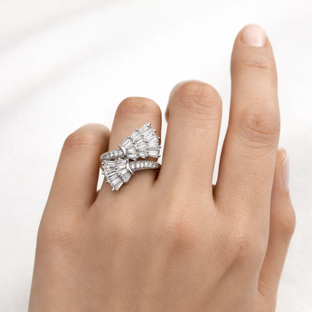 Diamond ring on a hand against a white background