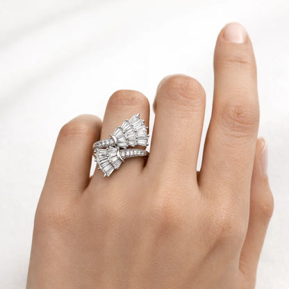 Diamond ring on a hand against a white background