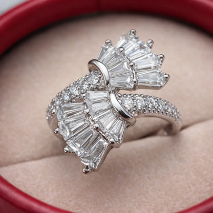 Diamond ring with baguette cut stones on a red cushion