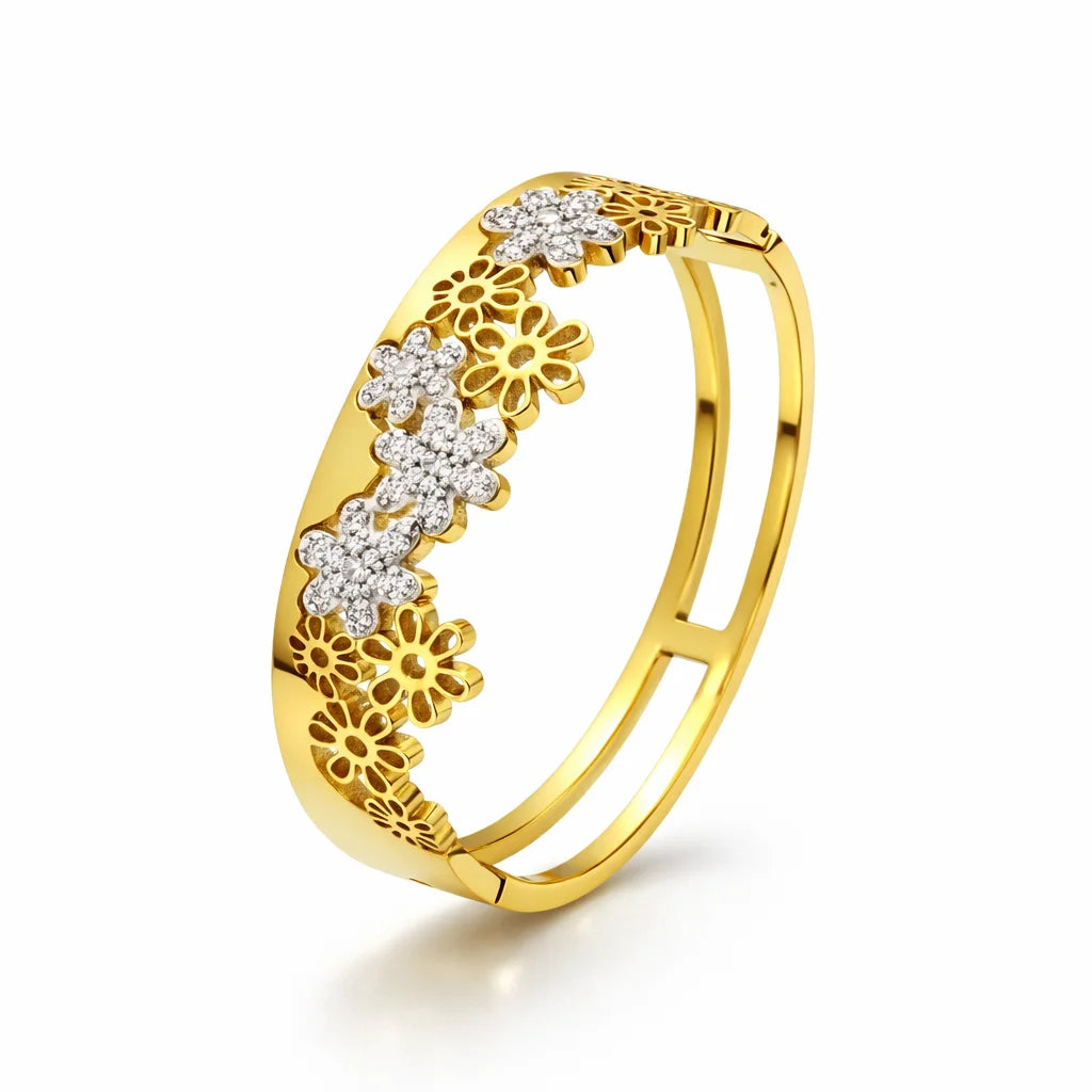 Gold ring with floral designs and small diamonds on a white background