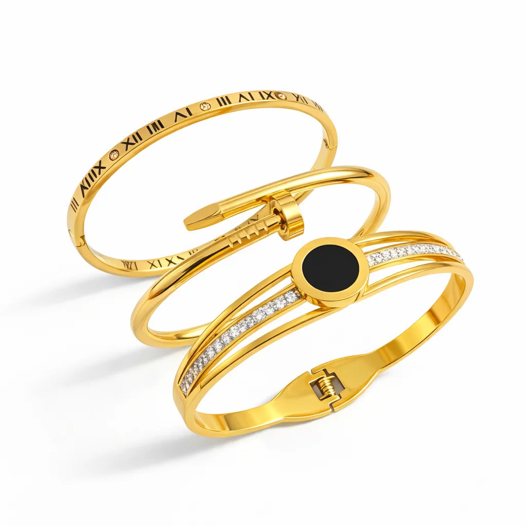Gold bracelet with black stone and diamond accents on a white background