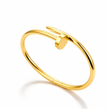 Gold bangle on a white background