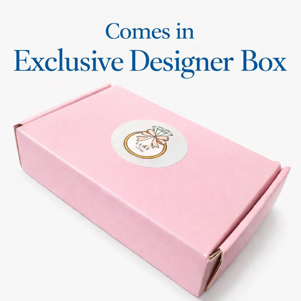 Pink box with a logo on a white background, text 'Comes in Exclusive Designer Box' above.