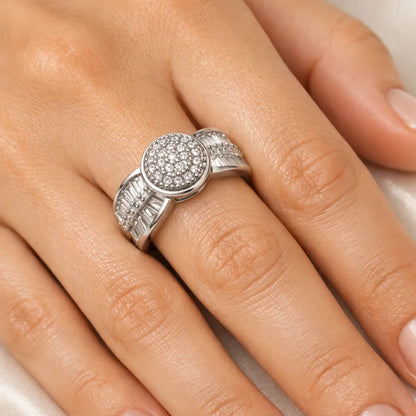 Silver ring with gemstones on a person's finger