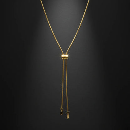 Gold necklace on a black background