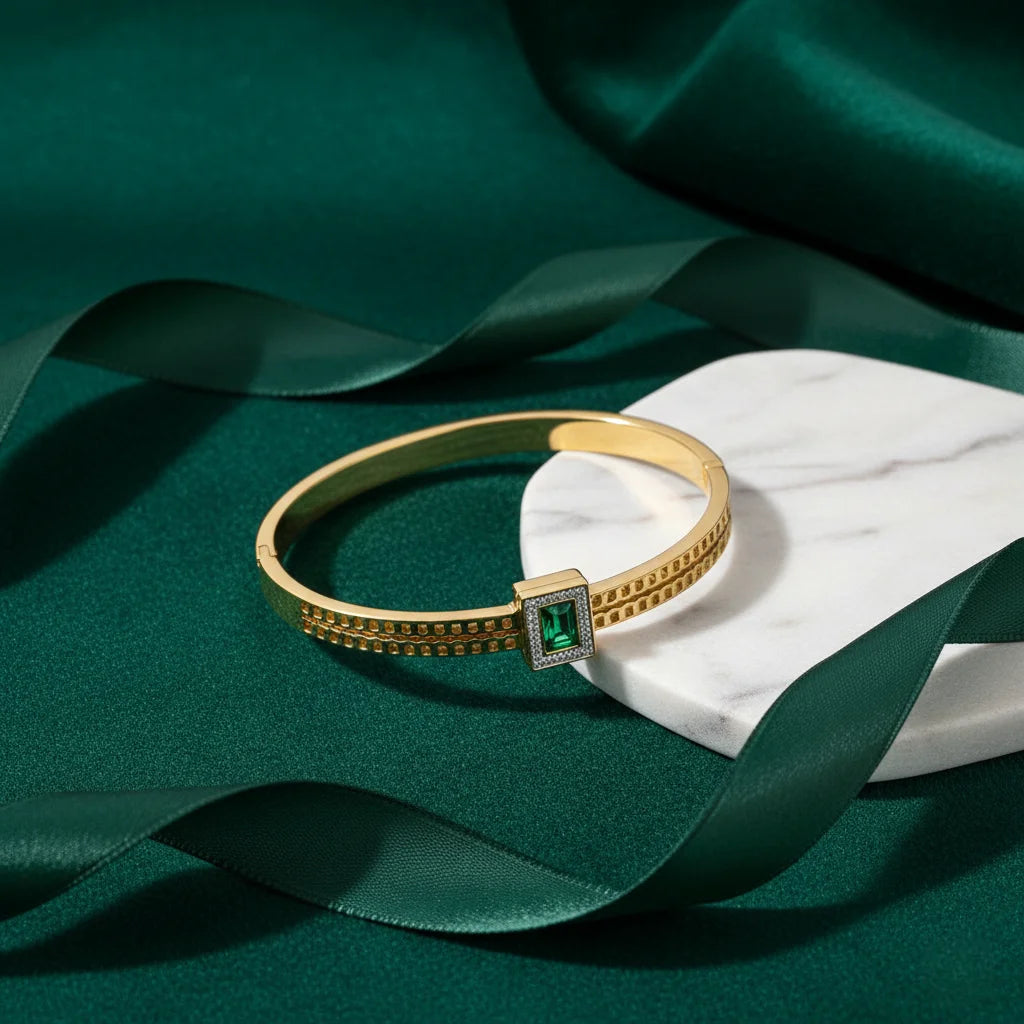 Detail gold cuff on green leather