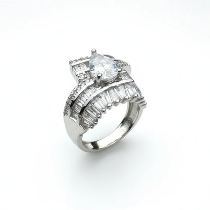 Silver ring with a large central diamond and smaller baguette-cut diamonds on a white background