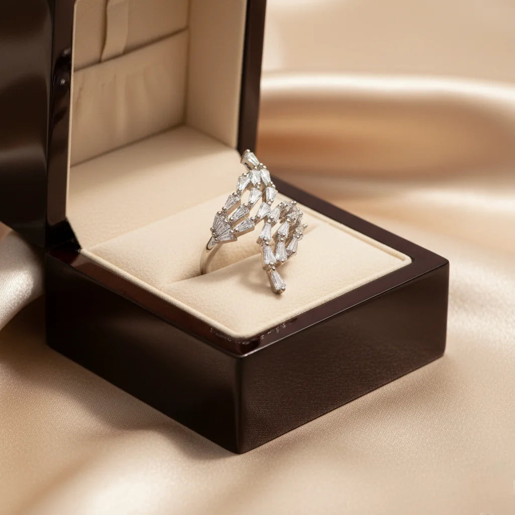 Diamond ring in a jewelry box on a beige background