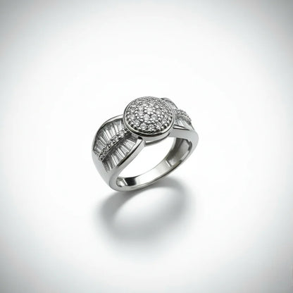 Silver ring with gemstones on a light gray background