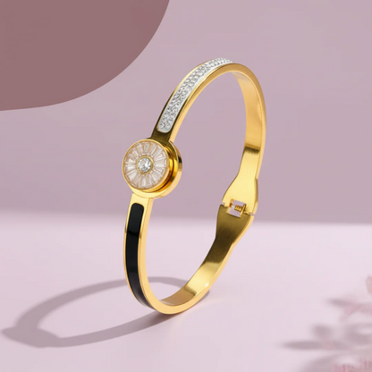 Gold bracelet with round center and black strip