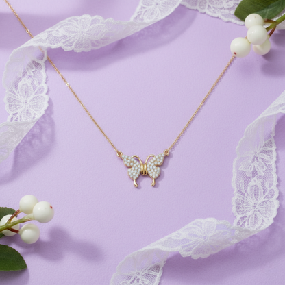 Butterfly-shaped necklace on a purple background with lace and berries