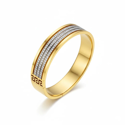 Gold ring with diamond accents on a white background