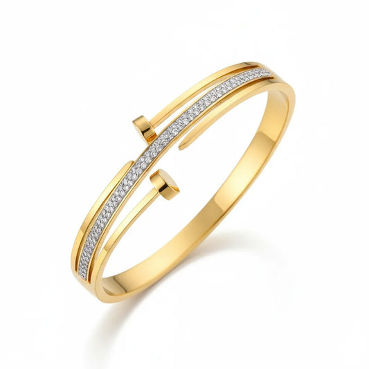 Gold bracelet with diamond accents on a white background