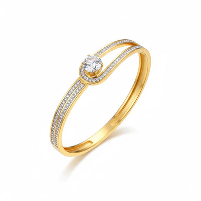 Gold ring with a diamond on a white background