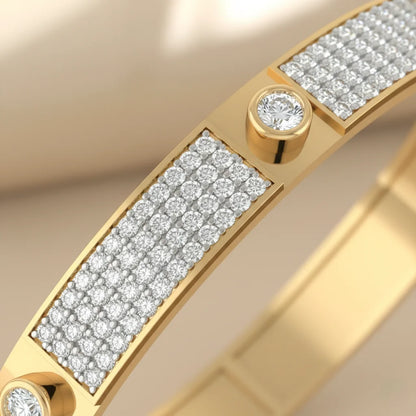 Gold bracelet with diamond accents on a beige background