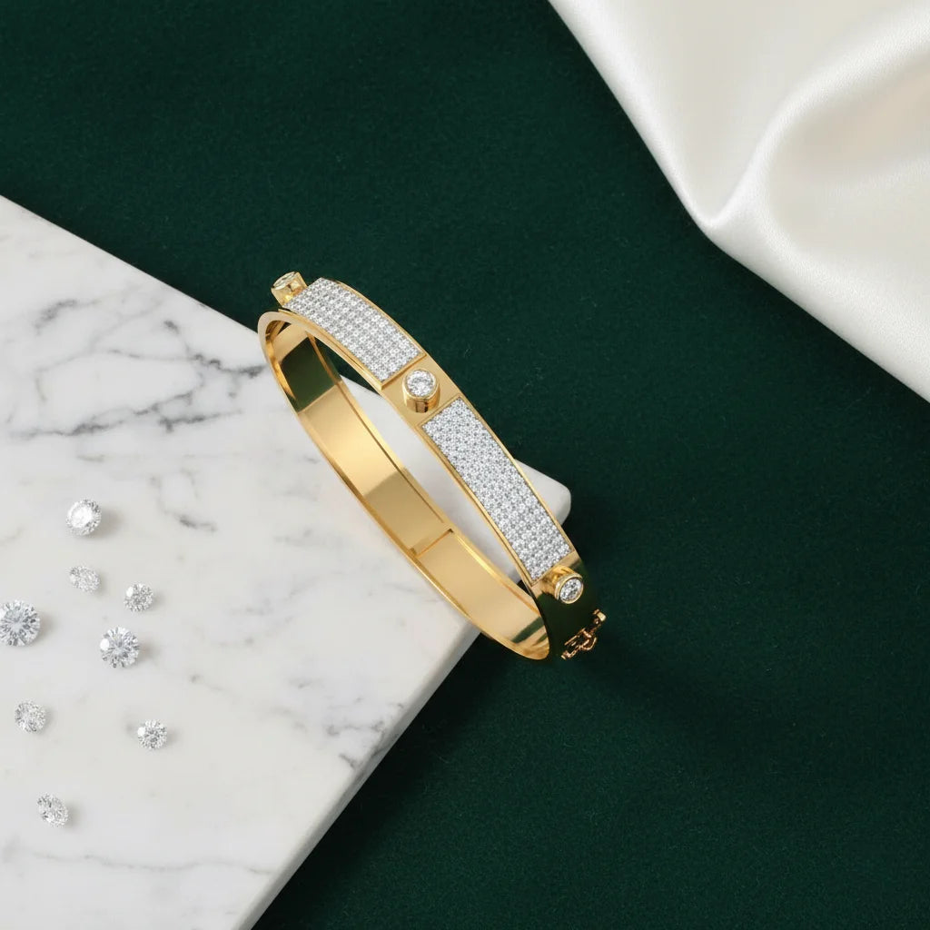 Gold bracelet with diamond accents on a dark surface