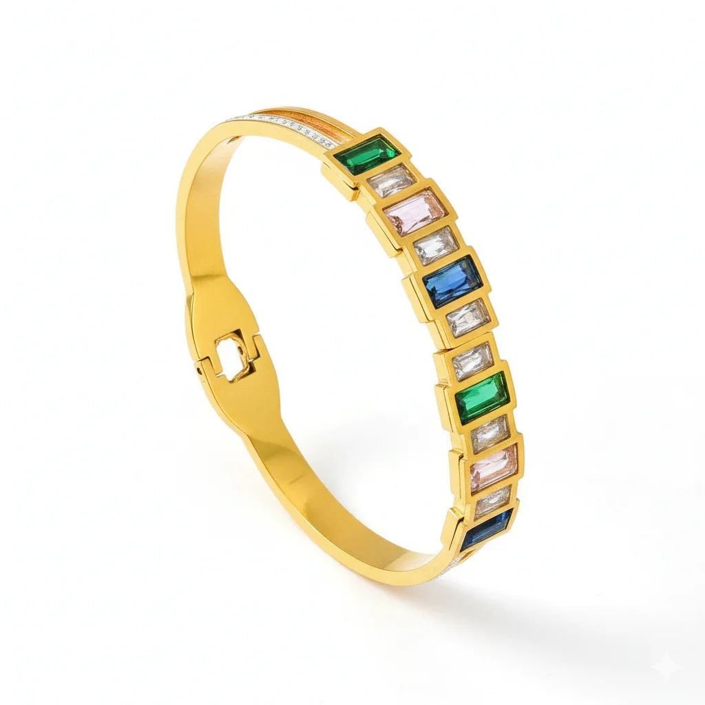 Gold bracelet with colorful gemstones on a white background