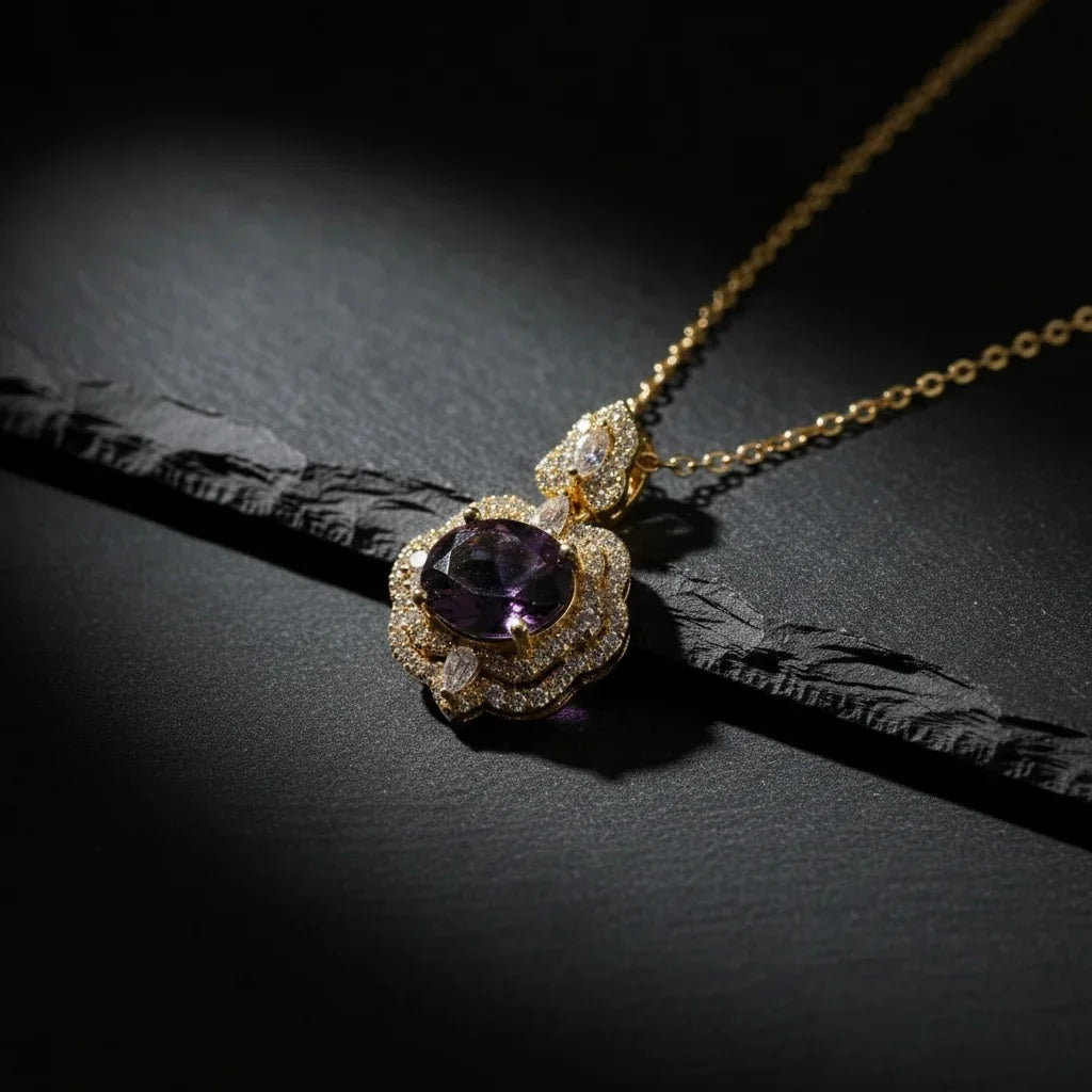 Delicate necklace with a purple gemstone pendant on a dark surface