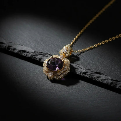Delicate necklace with a purple gemstone pendant on a dark surface