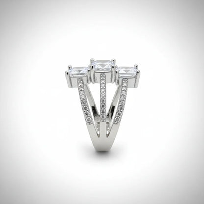 Diamond ring with three prominent stones on a white background