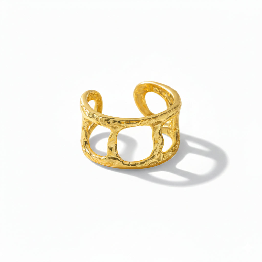 Gold open ring on a white background