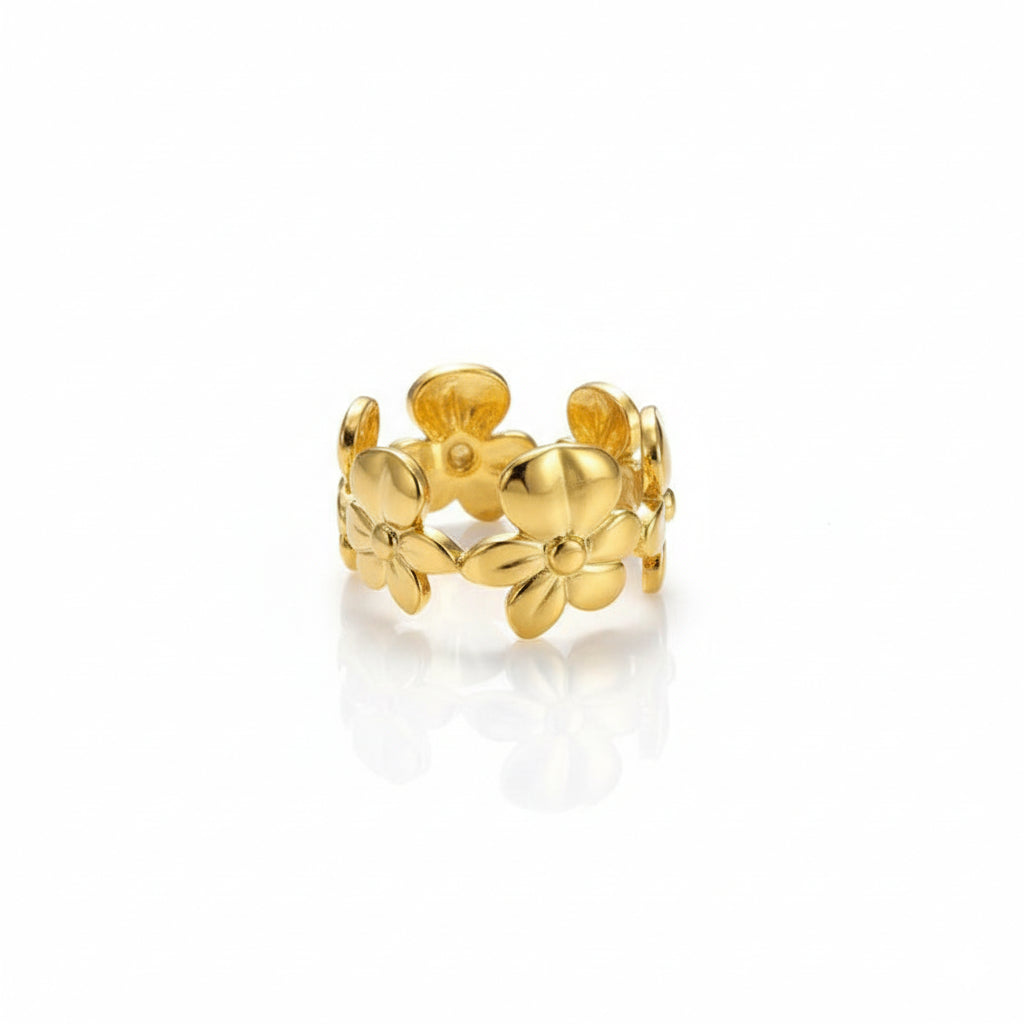 Gold floral ring on a white background
