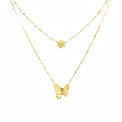 Two gold necklaces with a butterfly and flower pendant on a white background