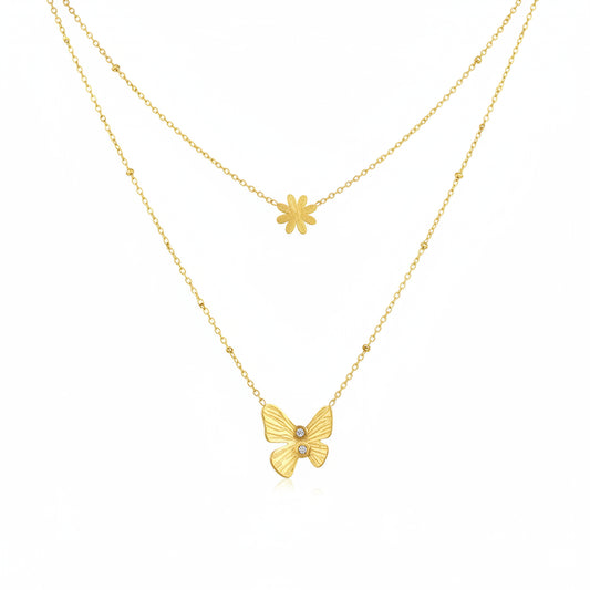 Two gold necklaces with a butterfly and flower pendant on a white background