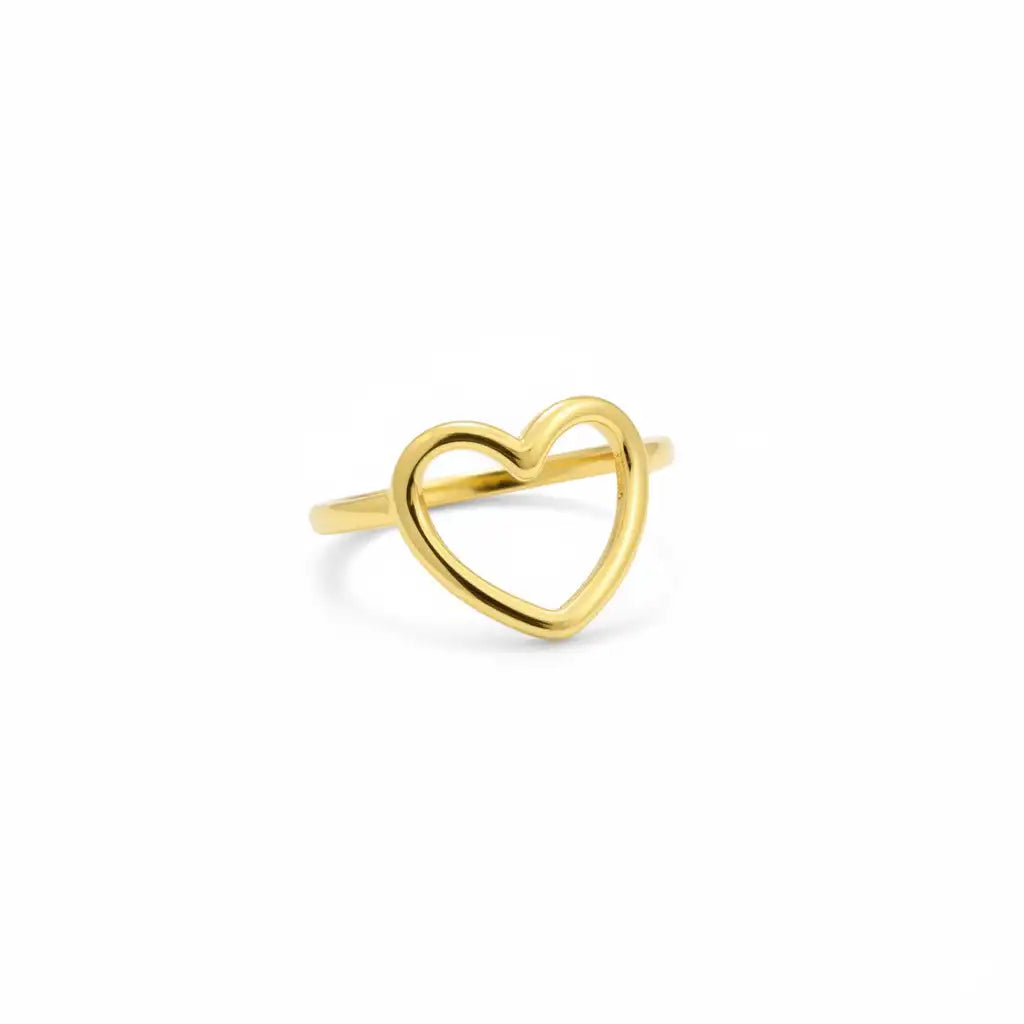 Gold heart-shaped ring on a white background