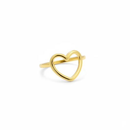Gold heart-shaped ring on a white background