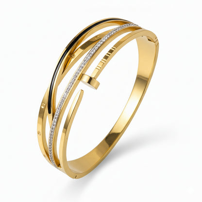 Gold bracelet with diamond accents on a white background