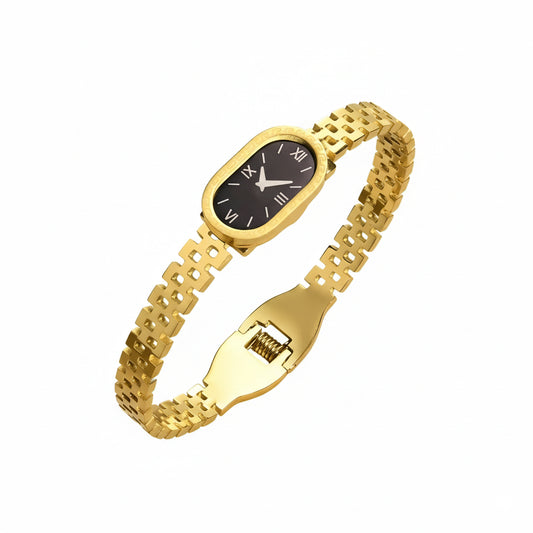 Gold wristwatch with a black face on a white background