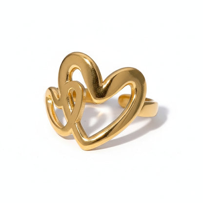 Gold heart-shaped ring on a white background