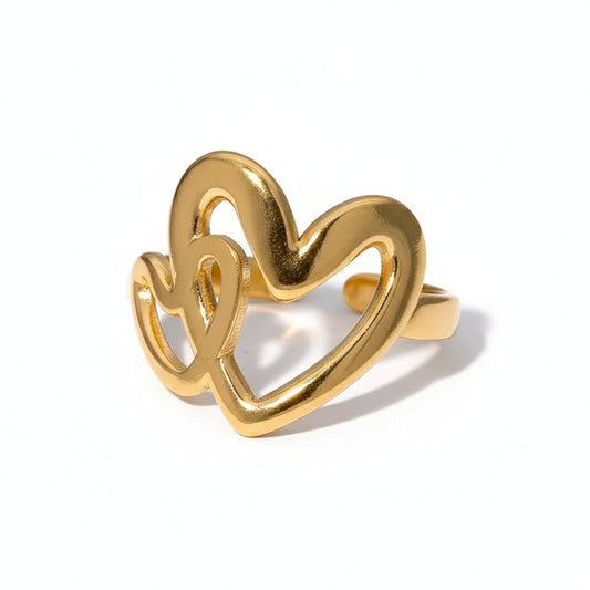 Gold heart-shaped ring on a white background