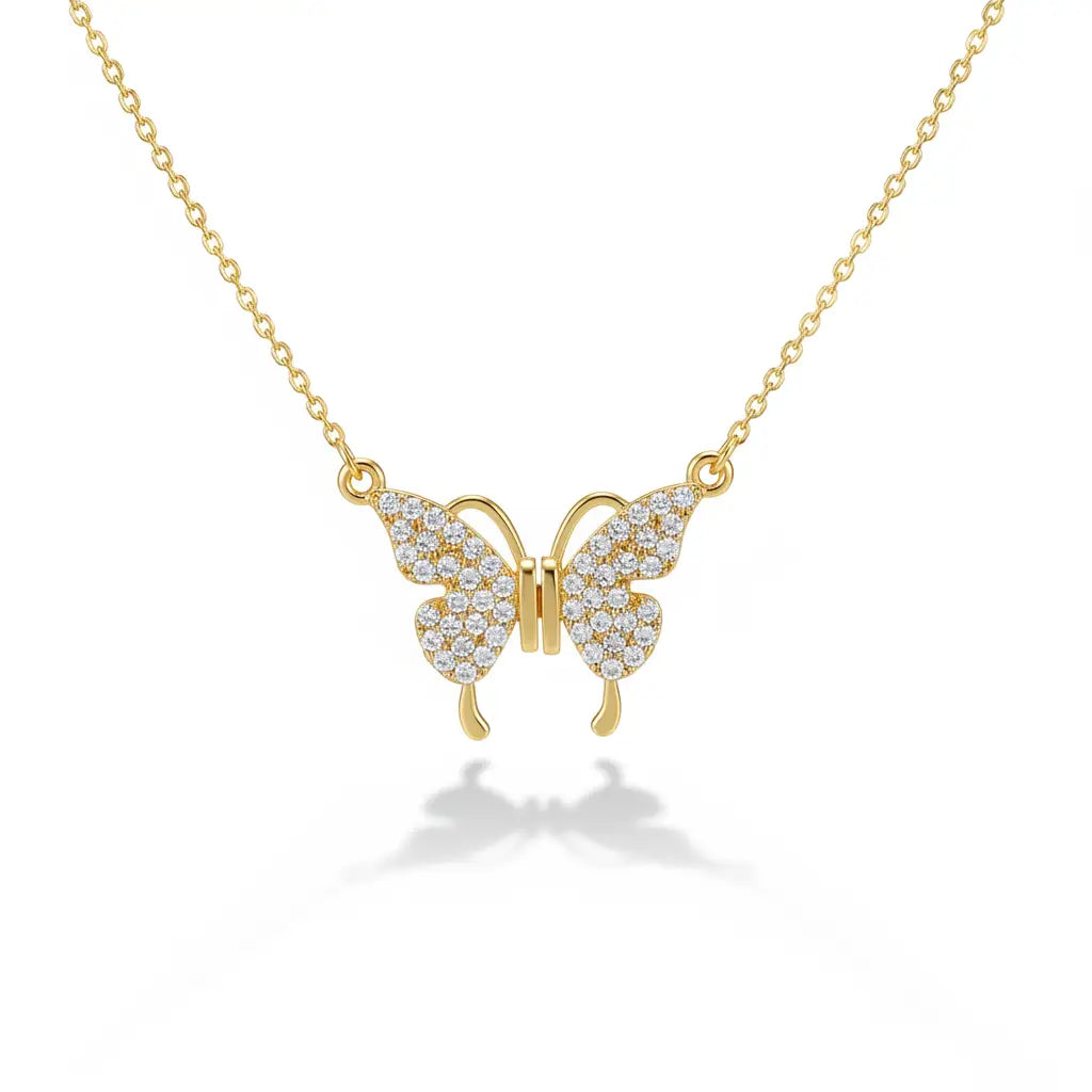 Gold butterfly necklace with diamond accents on a white background