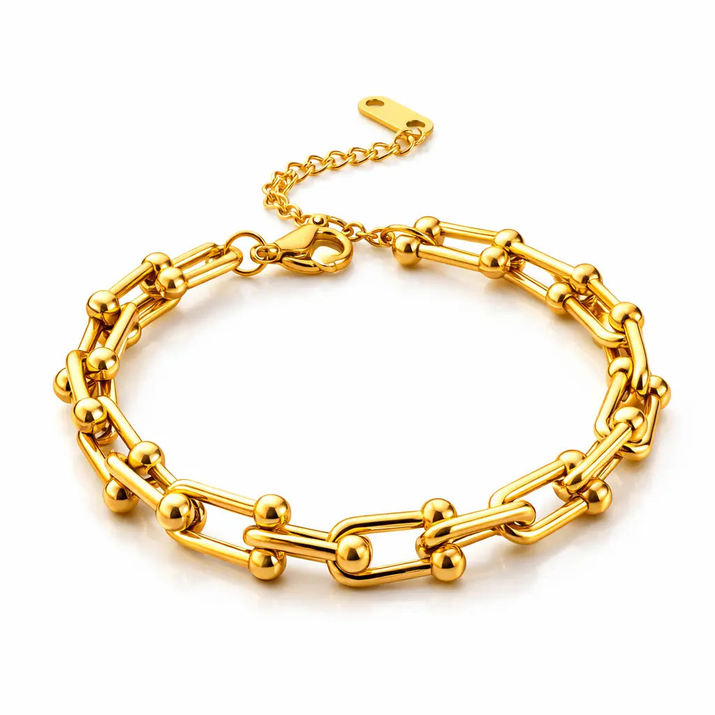 Gold chain bracelet on a white background