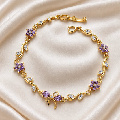 Purple zircon bow vine bracelet for women with lavender flowers on a gold-tone chain