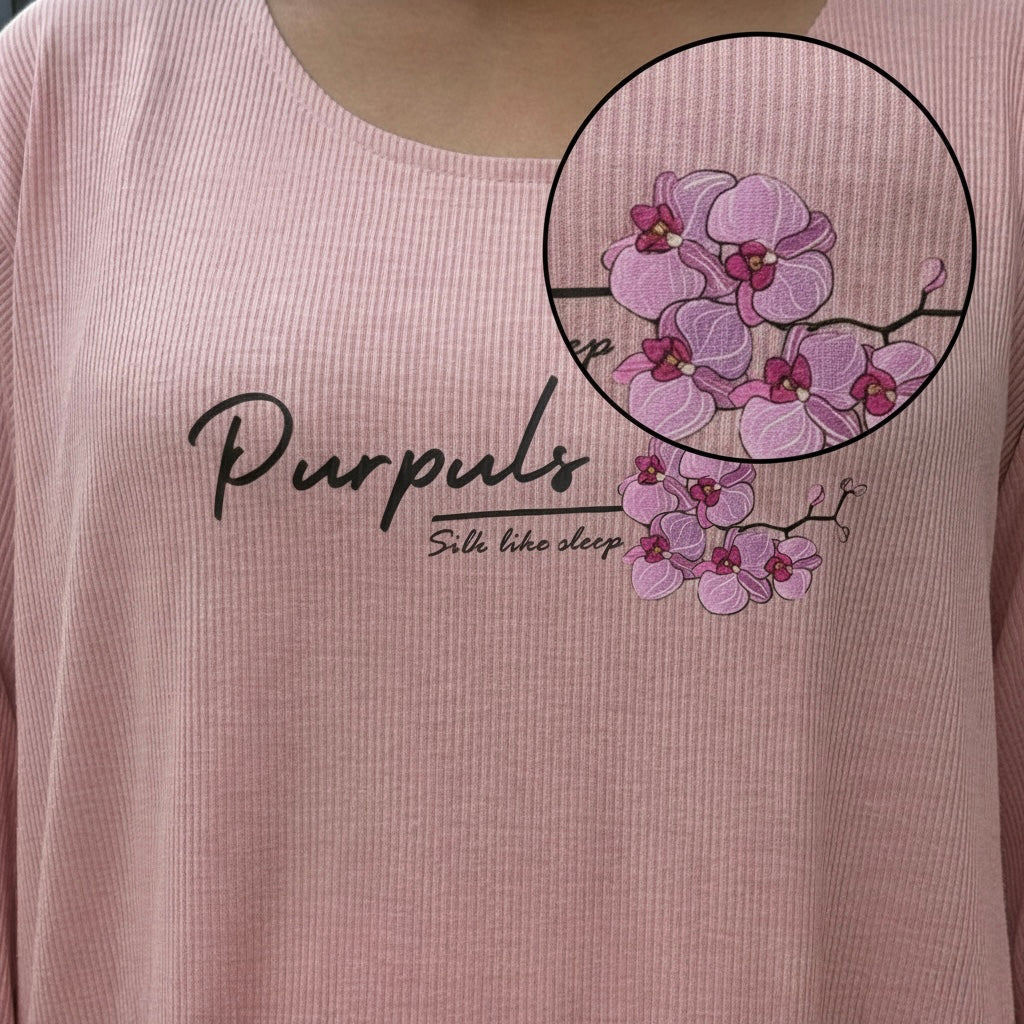 Pink shirt with floral design and 'Purpuls' branding