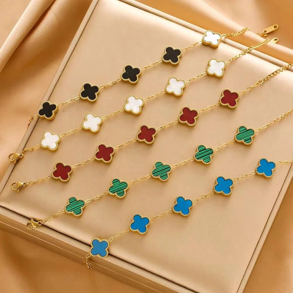 Colorful clover-shaped necklace on a beige surface