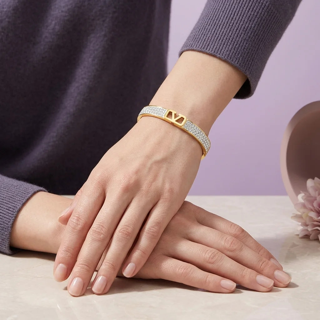 Gold bracelet on a hand with a soft background