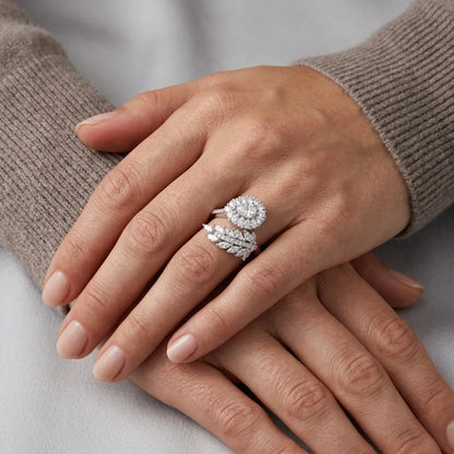 Close-up of hands wearing diamond rings on a neutral background