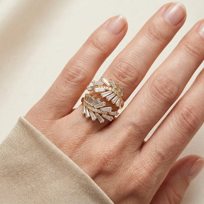 Hand wearing a decorative ring with a beige background