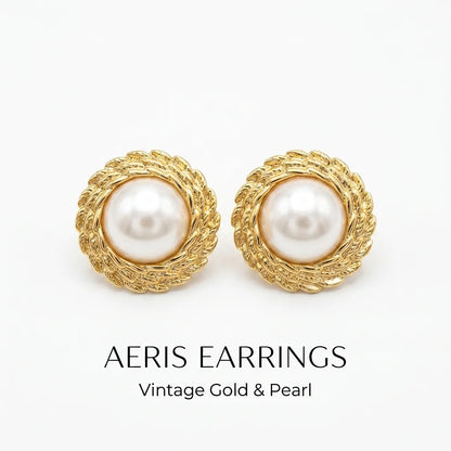 Pair of AERIS earrings with gold frames and pearl centers on a white background