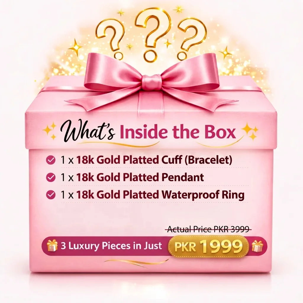 Pink gift box with gold bow and text about jewelry contents on a white background