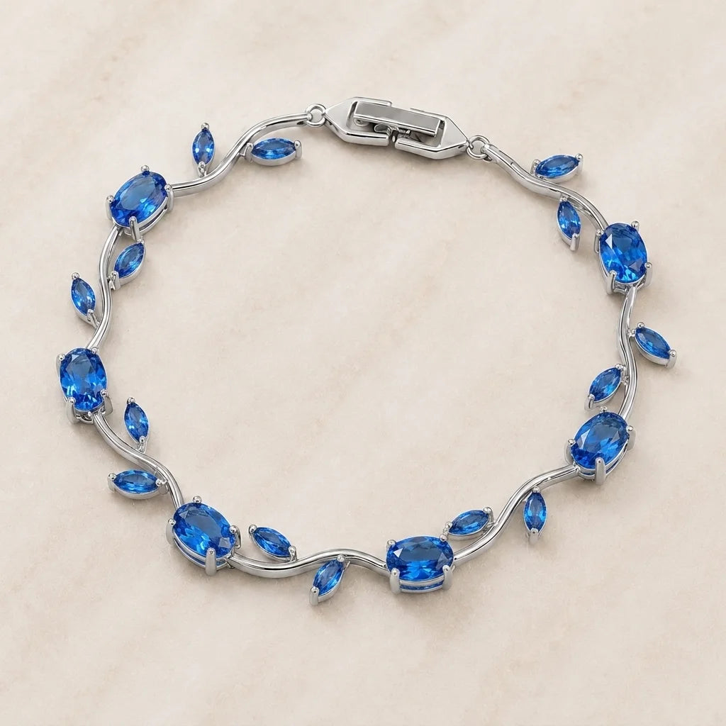 Silver bracelet with blue gemstones on a beige background