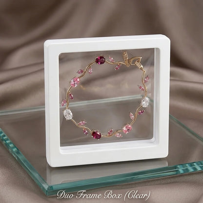 Jewelry display box with a decorative bracelet on a brown fabric background
