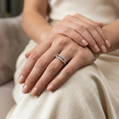 Modern diamond‑studded oval ring with delicate craftsmanship on a hand.
